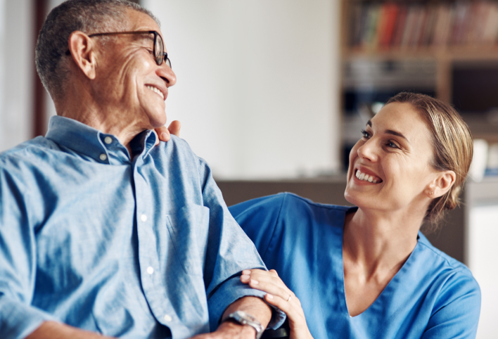 Healthcare worker smiling at a patient