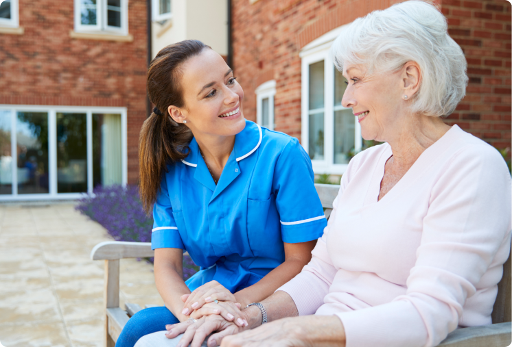 Nurse attending a resident outside of care home